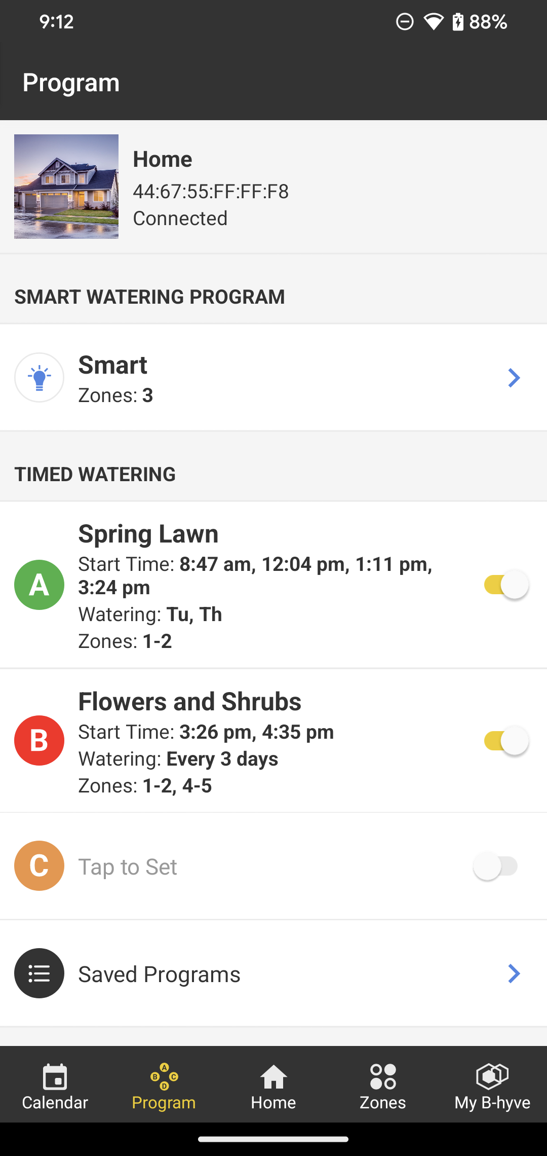 B-hyve app showing a Smart Watering program and two timed watering programs for Spring Lawn and Flowers and Shrubs.
